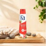 Fa Paradise Moments Deodorant Spray 48h with tropical design, placed on a wooden tray with spa elements.